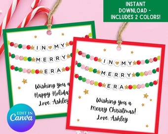 May include: Two printable Christmas gift tags featuring a red and green beaded garland design. The text on the tags reads "In My Merry Era" and "Wishing you a Happy Holiday" or "Wishing you a Merry Christmas!" with the name "Ashley".