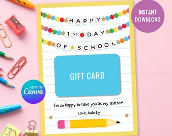 May include: A yellow gift card with a blue gift card area, decorated with a pencil and the text "Happy 1st Day of School." The card includes the text "I'm so happy to have you as my teacher! Love, Aubrey."