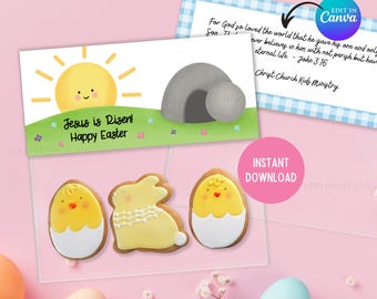 Può includere: Un biglietto di Pasqua stampabile con un sole allegro, una tomba e il testo "Gesù è risorto! Buona Pasqua!". Il biglietto è progettato per essere utilizzato con i biscotti, che sono mostrati nell'immagine. I biscotti sono un pulcino, un coniglio e un uovo.