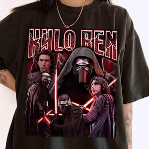 May include: Black t-shirt with a graphic of Kylo Ren from Star Wars. The design includes multiple images of the character, the name "KYLO REN" in red, and red lightning bolt accents. The shirt has a vintage, distressed appearance.