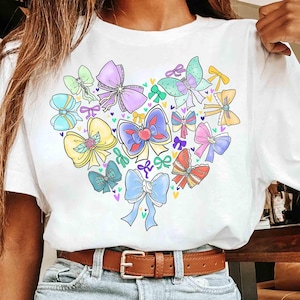 Coquette Bows Watercolor Disney Princess Shirt, Disney Aurora Ariel Belle Cinderella Tiana Shirt, Magic Kingdom Disneyland Girl Trip 2025