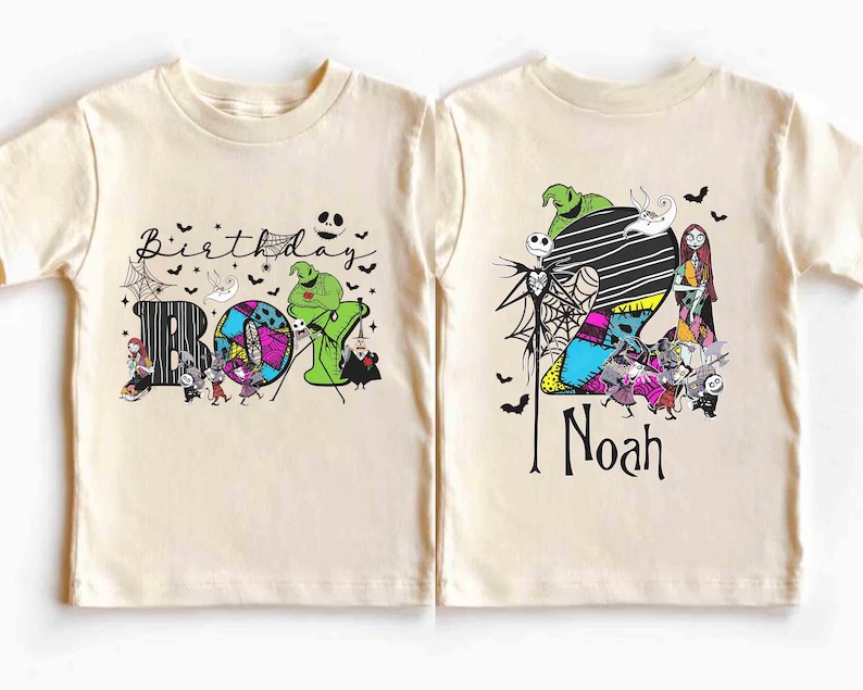 May include: A light beige short-sleeved t-shirt featuring a colorful graphic design. The front of the shirt says "Birthday Boy" with Halloween-themed characters. The back of the shirt has the name "Noah" and more Halloween characters.
