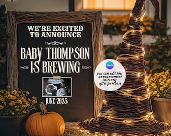 May include: A Halloween-themed pregnancy announcement featuring a chalkboard sign with the text "WE'RE EXCITED TO ANNOUNCE BABY THOMPSON IS BREWING JUNE 2025". An orange pumpkin and a witch's hat decorated with lights are also present.