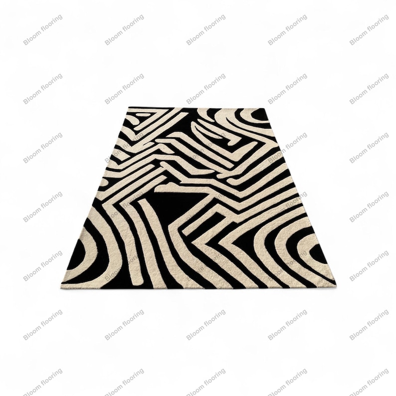 Scandinavian hand-tufted wool rug in black and white geometric pattern, plush minimalist decor for open space living room.