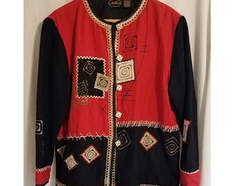May include: A red and black jacket with long sleeves. The jacket features decorative stitching, geometric patterns, and a cream-colored trim. The jacket has a round neckline and a button-up front.