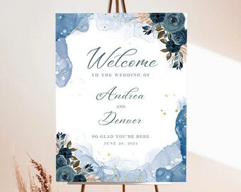 May include: Welcome sign for a wedding with a blue watercolor background and gold glitter. The sign says "Welcome to the wedding of Andrea and Denver, So glad you're here, June 30, 2024".