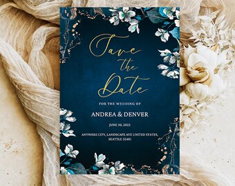 May include: Save the Date card with a navy blue background and gold lettering. The card is decorated with white flowers and gold glitter. The text on the card reads "Save the Date" for the wedding of Andrea & Denver, June 30, 2023, Anywhere City, Landscape Ave United States, Seattle 32481.