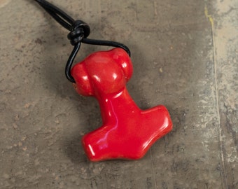 Handcrafted ceramic Skane Thor's Hammer Pendant glazed in red color.  Sold with leather or black cotton thread.