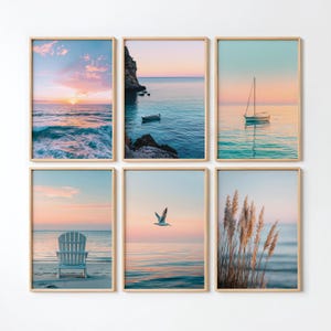 May include: A set of six framed wall art prints featuring coastal scenes. The images display a sunset over ocean waves, a small boat near rocky cliffs, a sailboat on calm water, an Adirondack chair on a beach, a seagull in flight, and tall beach grass.