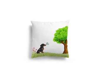 May include: A black and brown dachshund sits in a grassy field, looking up at a blue butterfly flying near a green tree.