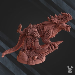 May include: A miniature figurine of a warrior riding a dragon. The warrior is wearing armor and holding a weapon. The dragon is a dark red color and has wings and a long tail.