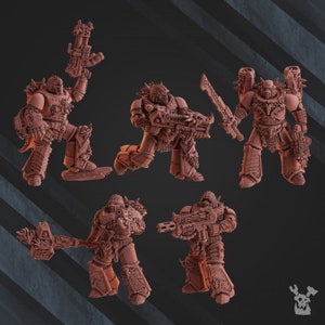 May include: Six reddish-brown miniature warrior figures in detailed armour. Each figure is posed in action, holding weapons like guns, swords, and hammers. The figures are intricately designed with spikes and ornate armour, suitable for tabletop gaming or display.