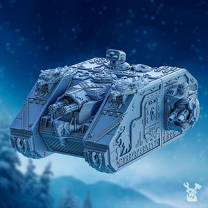 May include: A light blue, detailed model of a futuristic tank with multiple turrets and intricate designs. The tank features a boxy shape, with decorative elements and what appears to be runes etched on the side. The background is a blurred blue with a snowy effect.