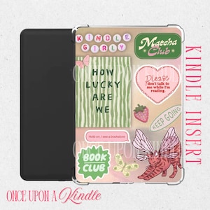 May include: A Kindle insert with a collage of stickers. The stickers include text like "Kindle Girly," "How Lucky Are We," and "Matcha Club." Other stickers feature a strawberry, a cat with butterfly wings, and a butterfly. The words "Kindle Insert" are printed vertically.