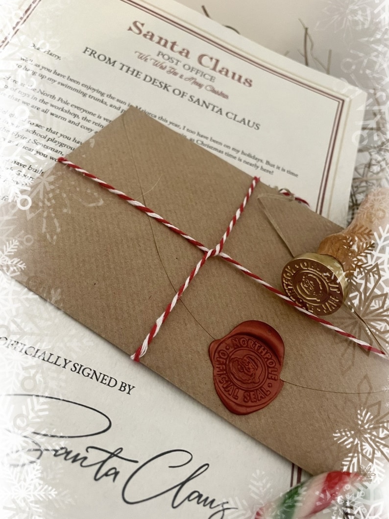 May include: A Christmas-themed image featuring a brown envelope sealed with red wax and a gold stamp. The envelope is tied with red and white twine and rests on a letter from Santa Claus. The letterhead reads "Santa Claus Post Office".
