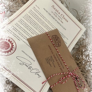 May include: A letter from Santa Claus, featuring a red wax seal and a brown envelope tied with red and white twine. The letter is addressed to Harry and signed by Santa Claus.
