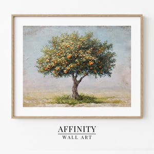 May include: A framed print of an orange tree heavy with fruit. The artwork shows a detailed depiction of the tree with a textured, painterly style. The print is set against a soft, muted background, with the text "AFFINITY WALL ART" at the bottom.
