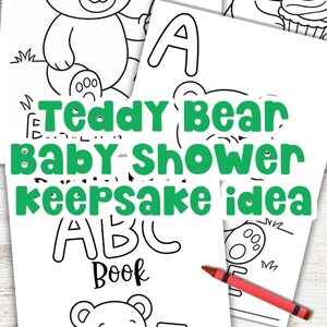 May include: Black and white line art illustrations of teddy bears holding balloons, cupcakes, and ABC blocks. The text "Teddy Bear Baby Shower Keepsake Idea ABC Book" is displayed in green. A red and orange crayon are also visible.