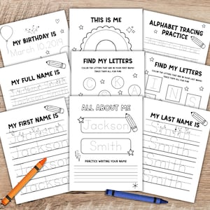 May include: A collection of white activity sheets for children, featuring handwriting practice and coloring pages. Titles include "My Birthday Is," "My Full Name Is," and "All About Me." Crayons in orange and blue are visible.