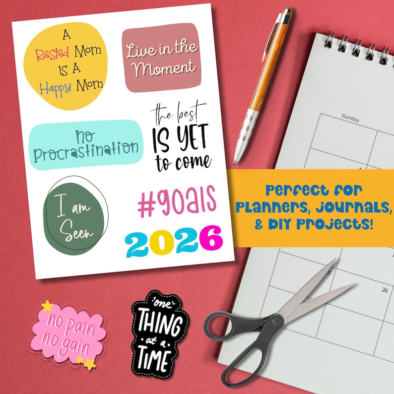 2026 Vision Board Words printable sheet with motivational quotes like Live in the Moment, The Best Is Yet to Come, and No Procrastination. Displayed beside a planner, pen, and scissors with text Perfect for Planners Journals and DIY Projects. Ideal for goal setting, journaling, and New Year inspiration.