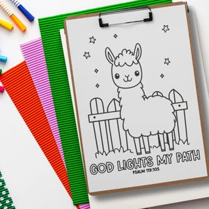 Printable Bible verse coloring page on a clipboard with God Lights My Path Psalm 119:105, surrounded by craft supplies for kids Bible printable activities, homeschool, and Sunday School.