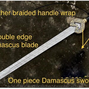 May include: A one-piece Damascus sword with a double-edged blade. The handle is wrapped in braided leather. The sword features an ornate, gold-colored guard. The text on the image reads "Leather braided handle wrap", "Double edge Damascus blade", and "One piece Damascus sword".