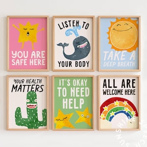 May include: Six framed art prints with uplifting messages. The prints feature illustrations of a star, whale, sun, cactus, and rainbow, alongside phrases like "Listen to Your Body" and "It's Okay to Need Help." The artwork is in bright, cheerful colours.