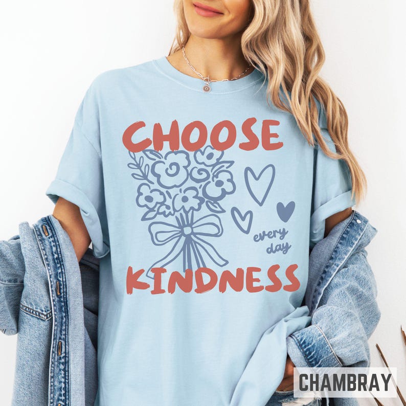 Comfort colors 1717 shirt that says Choose Kindness in large bold hand written font and has doodle images of a bouquet of flowers with a bow and hearts and the words every day written smaller in doodle cursive.