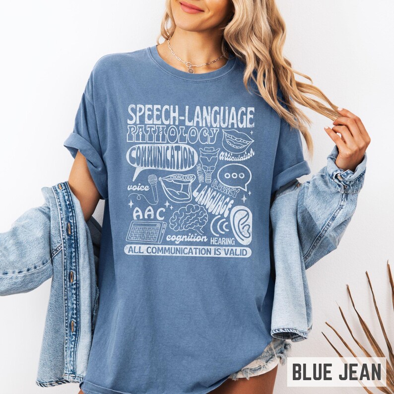 Oversized comfort colors retro-inspired shirt for speech therapist or SLPA with speech therapy scope of practice images on it and the words "All communication is valid." Gift for SLPs.