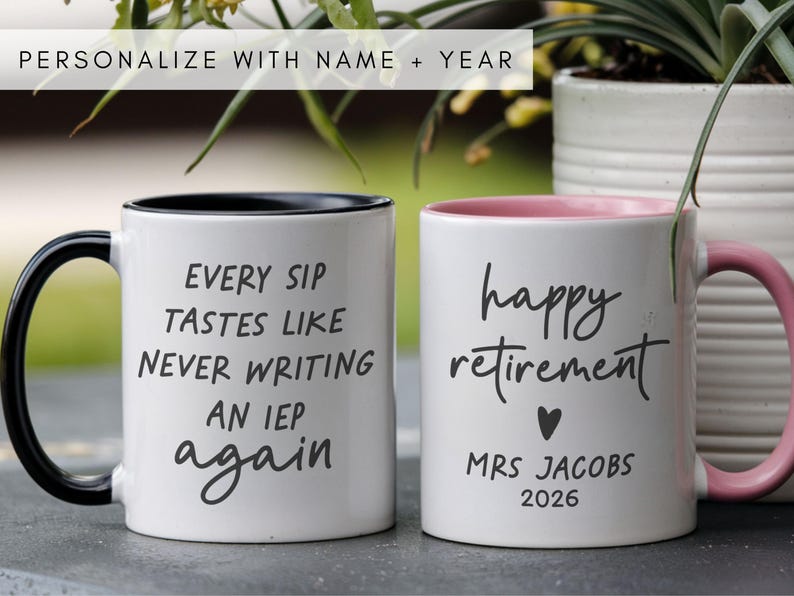 May include: Two white ceramic mugs with black and pink accents. One mug reads "EVERY SIP TASTES LIKE NEVER WRITING AN IEP again." The other says "happy retirement" with a heart, "MRS JACOBS 2026."