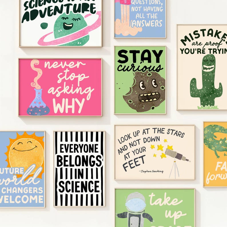 May include: A collection of framed art prints with science and inspirational themes. The prints feature colorful illustrations and text, including phrases like "Science is an Adventure" and "Everyone Belongs in Science."
