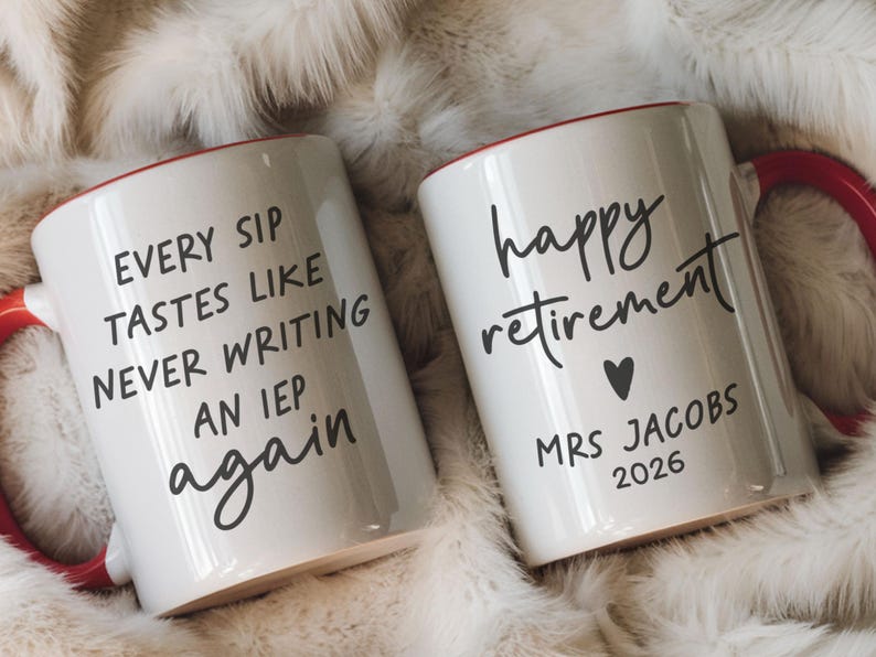 May include: Two white ceramic mugs with red handles and rims. One mug reads "EVERY SIP TASTES LIKE NEVER WRITING AN IEP again." The other mug says "happy retirement" with a heart and "MRS JACOBS 2026."