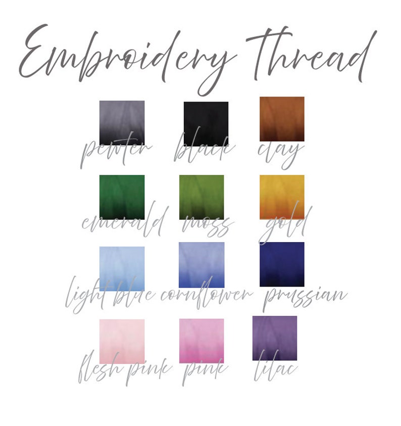 May include: A chart of embroidery thread colors with the names of each color listed below the color swatches. The colors are: pewter, black, clay, emerald, moss, gold, light blue, cornflower, prussian, flesh pink, pink, and lilac.