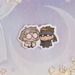May include: Two cartoon characters, one with gray hair and glasses and the other with brown hair and an eye patch, are depicted in a sticker. The characters are both wearing casual clothing and have a friendly expression.