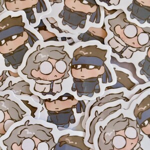 May include: A collection of white and gray cartoon character stickers. The characters have different facial expressions and are wearing different outfits. Some of the characters are wearing glasses and hats.