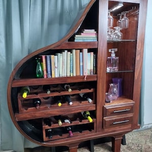Vintage Piano conversion to wine cart, bar, bookcase, display case,  custom speaker system from bluetooth