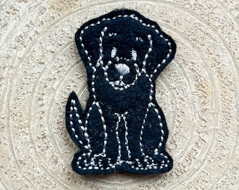 Zwarte labradorhond viltjes