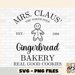 May include: Black and white graphic design with the text "Mrs. Claus, The North Pole Est. 1989 Gingerbread Bakery Real Good Cookies" and a gingerbread man illustration.