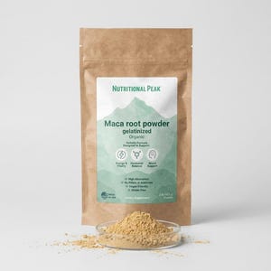 May include: A brown paper pouch of Nutritional Peak organic gelatinized maca root powder with a white label featuring a green mountain graphic, text, and icons. A small glass dish filled with light brown powder sits in front of the pouch.