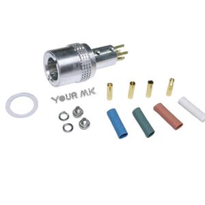 May include: A silver electrical connector with multiple pins, alongside gold pins, coloured sleeves, washers, and a white O-ring. The text "YOUR MK" is also present.