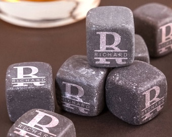 May include: Eight gray stone whiskey chilling cubes with the letter "R" and the name "Richard" engraved on each cube.