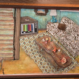 May include: A framed mixed-media artwork depicting a living room interior with a staircase, a television displaying color bars, a patterned sofa with a brown cushion, and a wooden coffee table on a patterned rug, all rendered in a colorful style.