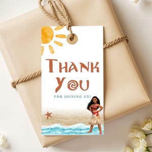 May include: A gift tag with the words "Thank You" in brown lettering, featuring a watercolour sun, beach scene, and a cartoon character. The tag is attached to a wrapped gift with twine.