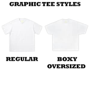 May include: Image showcasing two white graphic tee styles: "Regular" and "Boxy Oversized." The text "Graphic Tee Styles" is at the top. The shirts are plain, with short sleeves and a crew neck. The "Boxy Oversized" tee has a wider fit.