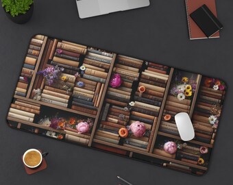 May include: A brown and black mouse mat with a bookshelf design featuring a variety of books and flowers. The books are arranged in a grid pattern and the flowers are scattered throughout the design.