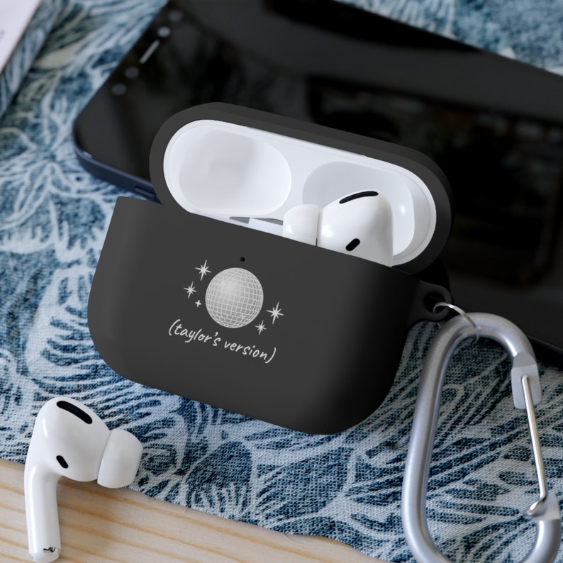 Apple airpod mirrorball pro case in black which says taylor's version in delicate font with a picture of a discoball as it is one of taylor swift's songs.