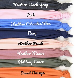 a bunch of different colored headbands on a white background