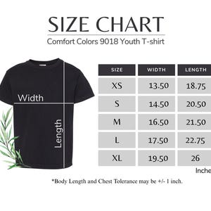 The image is a size chart for a youth t-shirt, providing measurements for different body sizes. The chart includes a black t-shirt and a plant, with the t-shirt size chart on the left side and the plant on the right side. The chart includes a table with the width, length, and corresponding measurements for each size. The chart also includes a note that "Body Length and Chest Tolerance may be +1 inch."