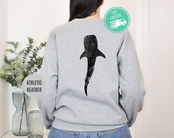 May include: A gray sweatshirt with a black and white whale shark graphic on the back. The sweatshirt is labeled "Athletic Heather".