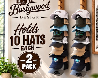 May include: Two vertical wooden wall-mounted hat racks, each holding ten baseball caps in various colors including white, black, blue, and tan. The wall features text reading Burlywood Design, Holds 10 Hats Each, and 2 Pack, with a mountain graphic.